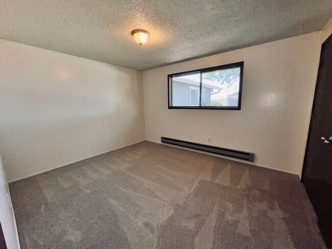 Building Photo - Single-Level 2 Bedroom / 1 Bath Triplex Unit on 1/2 Acre in East Bend  -  Move-In Special * up to...
