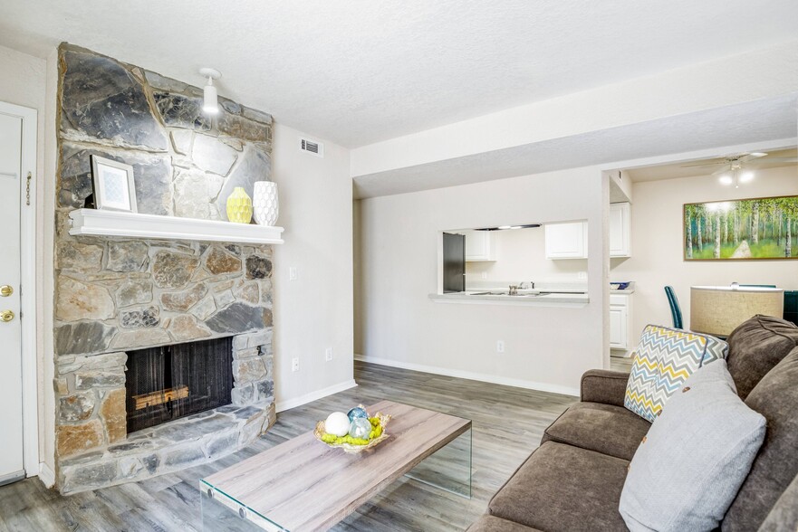 Living Room with Fireplace - Windrush Apartments