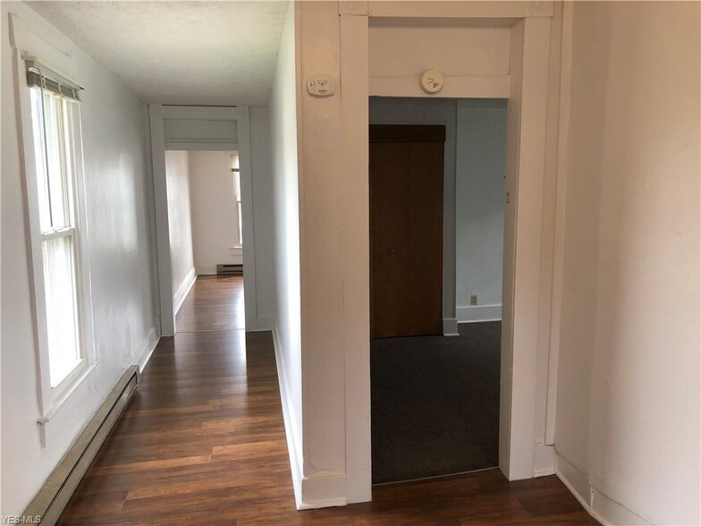 View from Kitchen into Bedroom (right) and hallway into the Living Room - 308 S Jefferson St