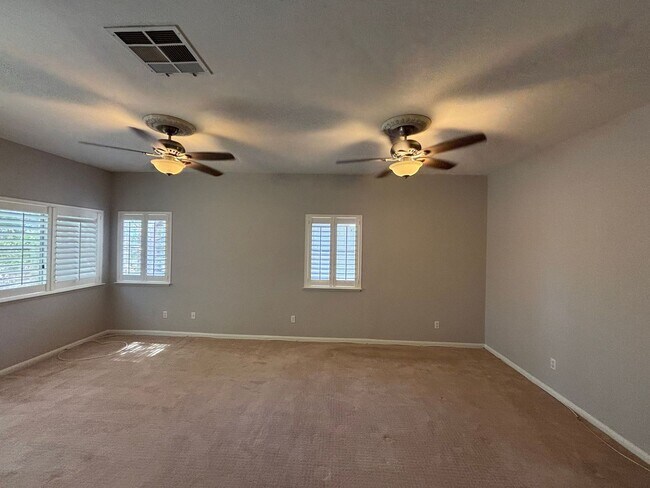 Building Photo - Gated Green Valley Ranch Townhome | 2 Bed | 2.5 Bath | 2-Car Garage