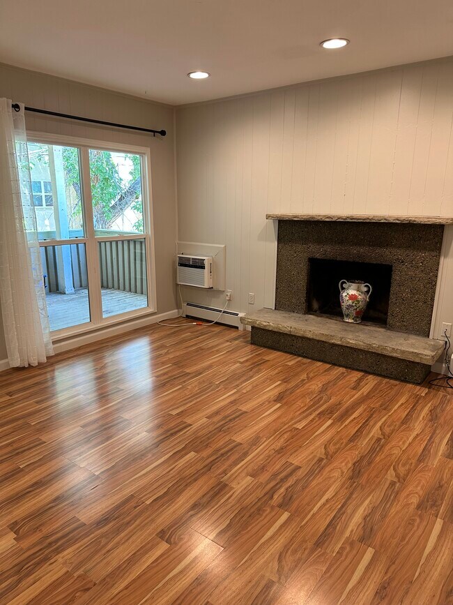 Living area with Large Windows and Decorative Fireplace - 3035 Oneal Pkwy