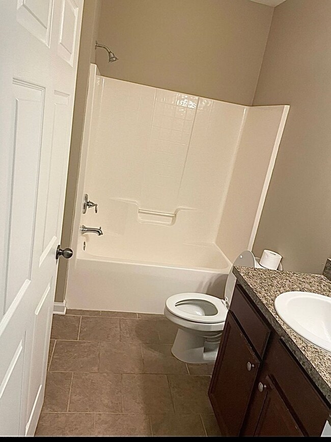 Building Photo - 4 BR/ 2 BA with 1 car garage home located in Villas at Pine Forest