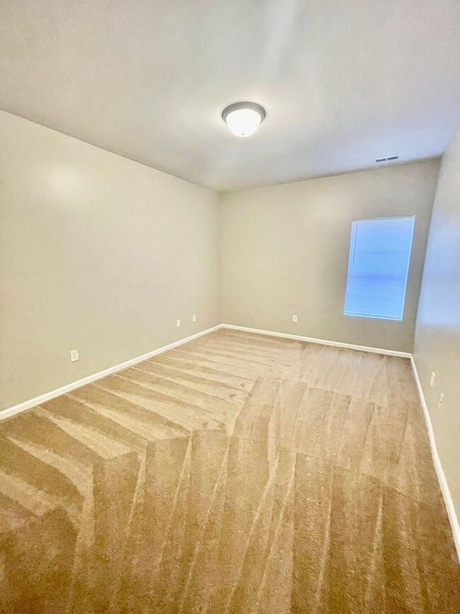 Building Photo - This two-story, 4-bedroom, 2-bath duplex in Fort Mill, SC sits on a corner lot