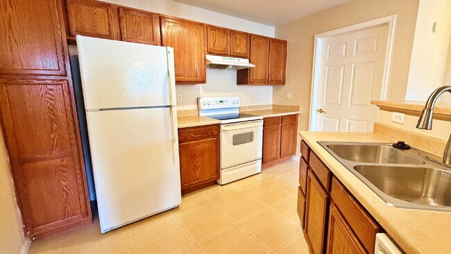 Building Photo - NEW CARPET NEW PAINT!! Clean and Bright 2BR 2BTH Condo Close To DIA. Gated Community in First Cre...