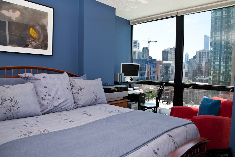 Bedroom just painted a light color. Photo shows furniture fit. Queen bed, arm chair, dresser all fit - 1122 N Clark St