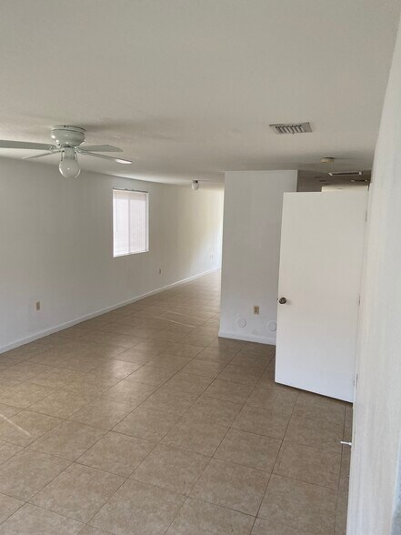 Living room view from bottom of staircase - 812 NW 22nd Pl