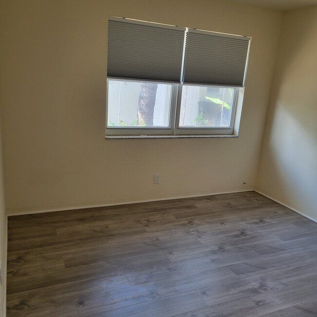 freshly painted bedroom with blackout blinds - 2031 NE 56th St