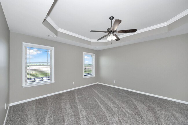 Building Photo - Fresh Paint & New Carpet! 4BR with Fenced Yard