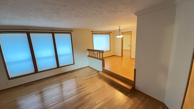 Building Photo - 4bd/3ba HUGE Home w/Hardwood Floors, Russian Fireplace, 2-Car Garage & Fenced Back Yard!