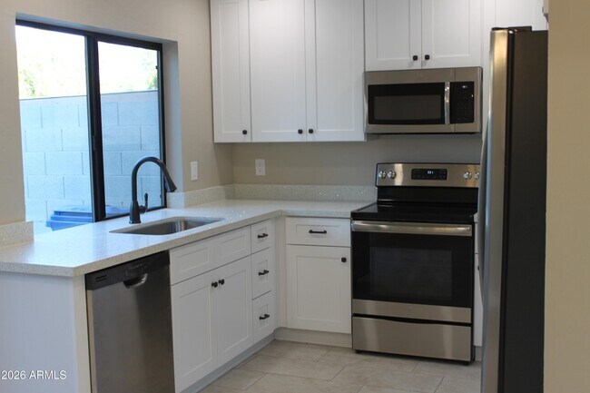 Building Photo - 1550 N Stapley Dr