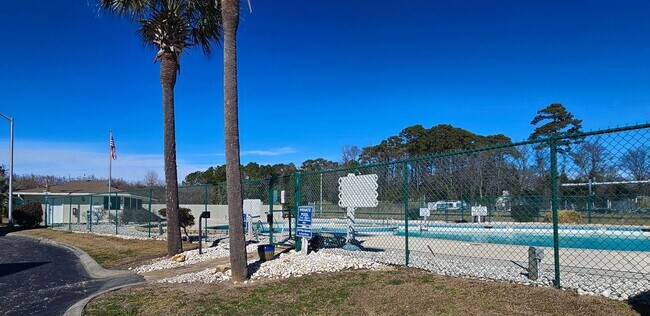 Building Photo - Dreamy Little River Condo — Furnished, Elevator Access, Pool & Marina Nearby!