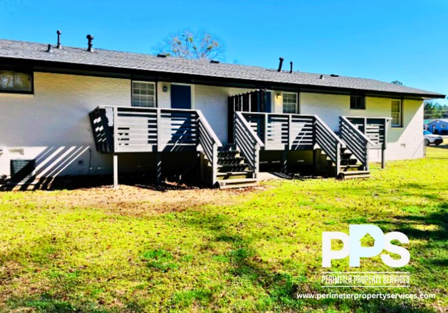 Building Photo - 6127-6129 E Fayetteville Dr