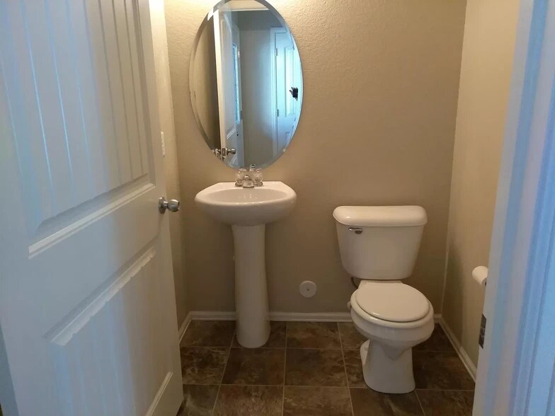 first floor half bath - 3070 Harpy Grove