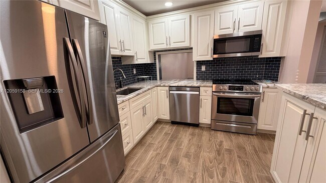 Building Photo - 6090 N Sabal Palm Blvd