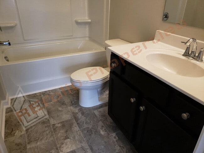 Building Photo - Beautiful Luxury 3 Story 3 Bedroom Townhome with 1st Floor Guest Suite, Attached 2 Car Garage, Co...