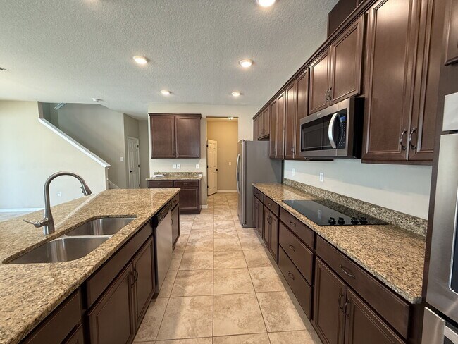 Building Photo - Spacious 4-Bedroom Retreat with additional office/den in the Heart of Trinity!