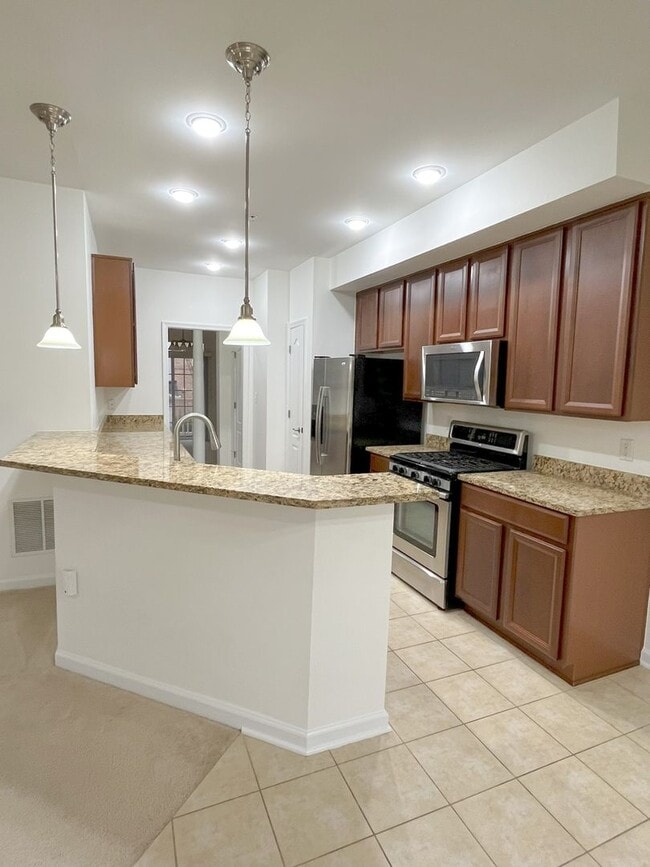 Building Photo - Sizable End Unit Townhome in Wheaton w/ 2 Car Garage!