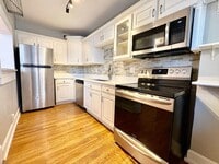 Building Photo - Top-Floor 2 Bedroom Condo in Gated Community with Huge Balcony & Elegant Marble Bath