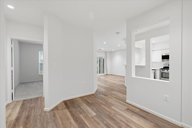 Building Photo - Commuter’s Paradise! Ground-Level 2BR Condo  Welcome home to this stunning, sun-filled 2-bedroom ...