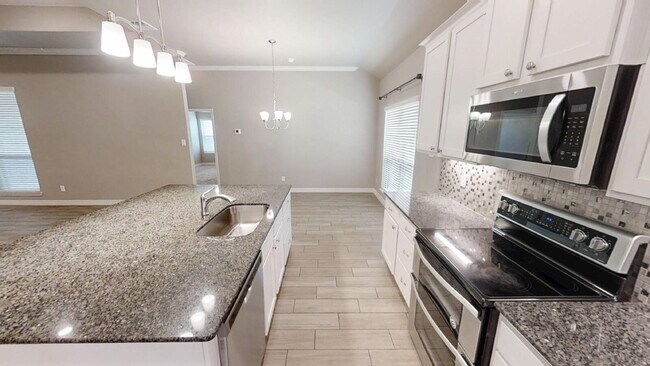 Building Photo - "Charming 4-Bedroom Retreat with Granite Elegance & Cozy Fireplace in Killeen!"