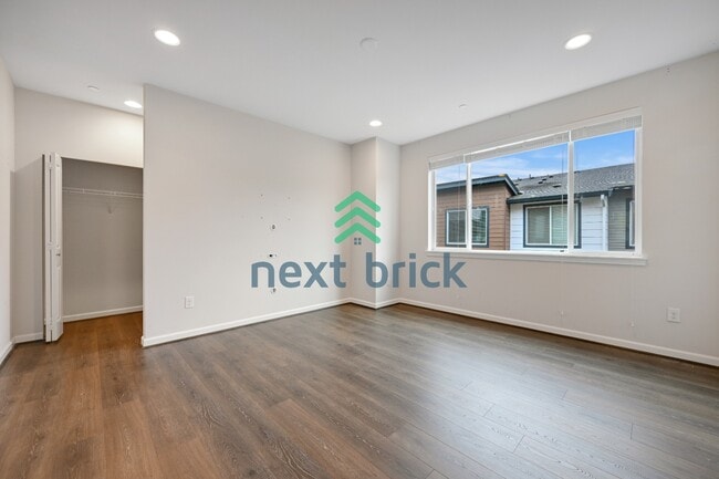 Building Photo - A Beautiful Corner Home Designed for Comfort, Light & Community!