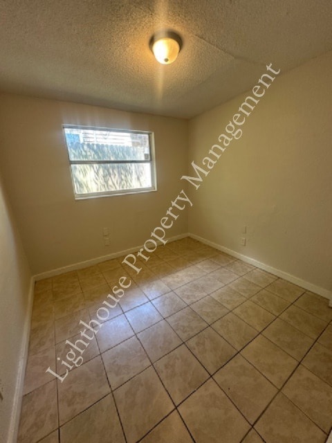 Building Photo - Bright 4 Bedroom Home With Tile Flooring Throughout
