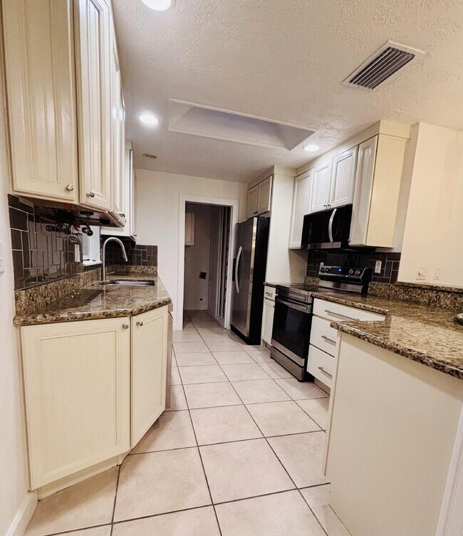 Building Photo - Coastal 4-Bedroom Oasis – Walk to the Beach!