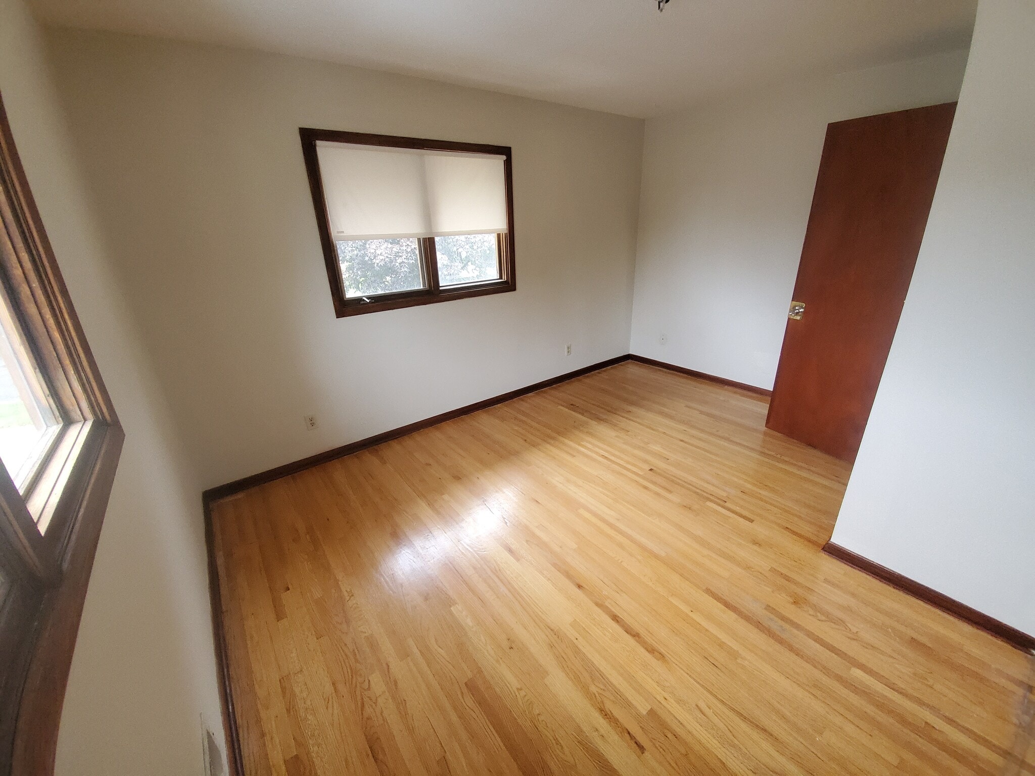 Bedroom #1 Hardwood floors 2 windows great for natural sunlight and cross breeze - 1182 Lane Pl