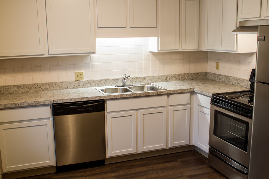 New Kitchen with bright cabinets - Stow Reserve Apartments