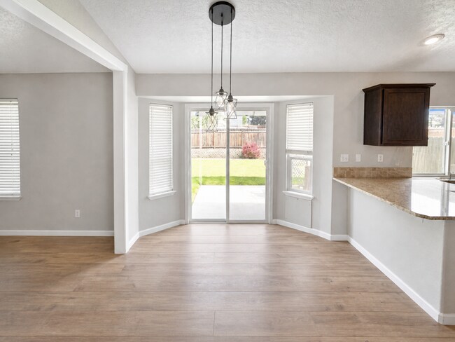 Building Photo - Spacious Home with 3-Car Garage, Two Living Areas & Covered Patio