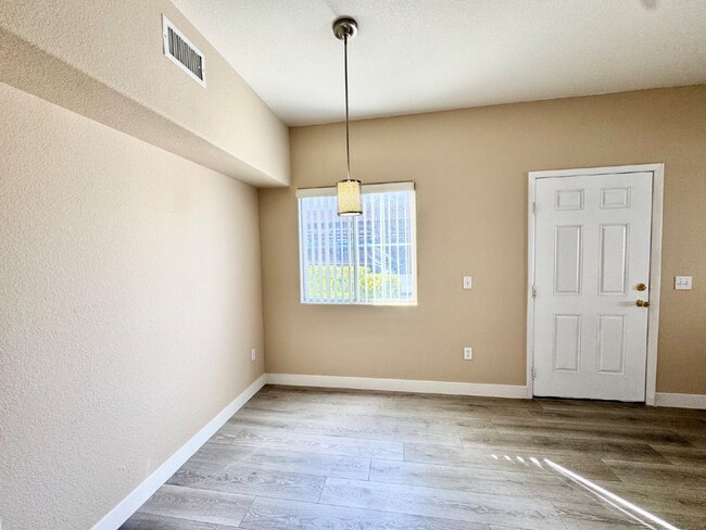 Building Photo - DOWNSTAIRS CONDO | GATED COMMUNITY | CENTENNIAL HILLS | UPDATED 3 BEDROOM