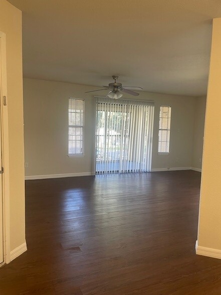 Apartment 406- On Special for $1300, open livingroom with plank flooring - Hidden Palms Apartment Homes