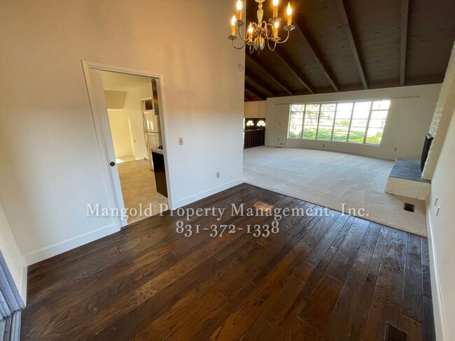 Building Photo - Beautiful 4-bed 2-bath Home with Cozy Fireplace, Front and Back Yards and Large Windows!