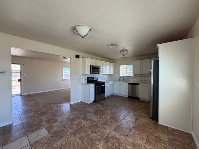 Building Photo - 3 Bedroom 2 Bathroom House with Central A/C , 2 Car Garage and Beautiful Backyard with Covered Patio