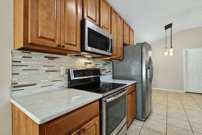 Building Photo - 1727 Canopy Oaks Dr