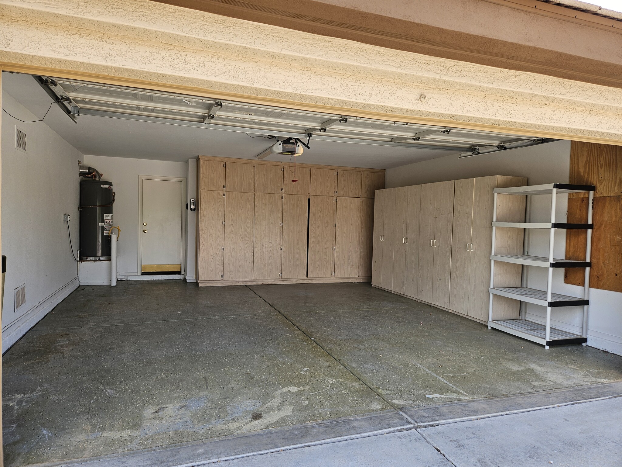 Two Car Garage w/storage cabinets - 20408 N 70th Dr