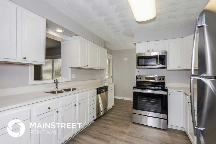 Building Photo - 7706 Poinsettia Dr