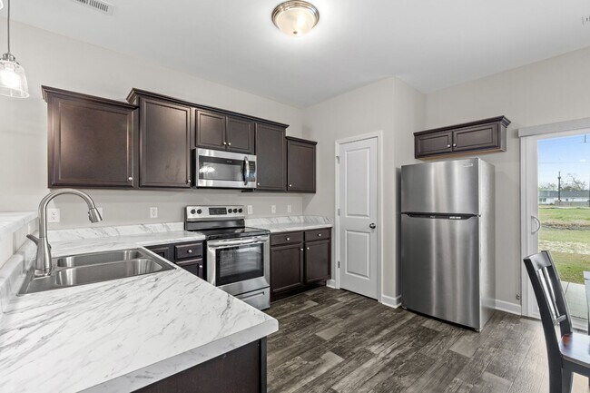 Building Photo - Marshall Farms Beauty with Dual Suites & Open-Concept Living