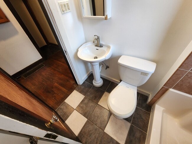 Building Photo - 4 BR home with first-floor living, new roof, and a private-feeling backyard in Lincoln Place