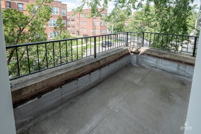 Building Photo - Modern 4BR Apartment with Hardwood Floors, Balcony & Central A/C