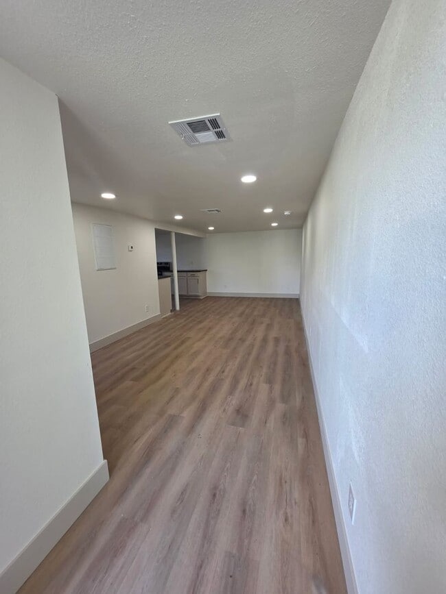 Building Photo - Studio Apartment with bathroom, kitchen & utility area on the lower level of property.