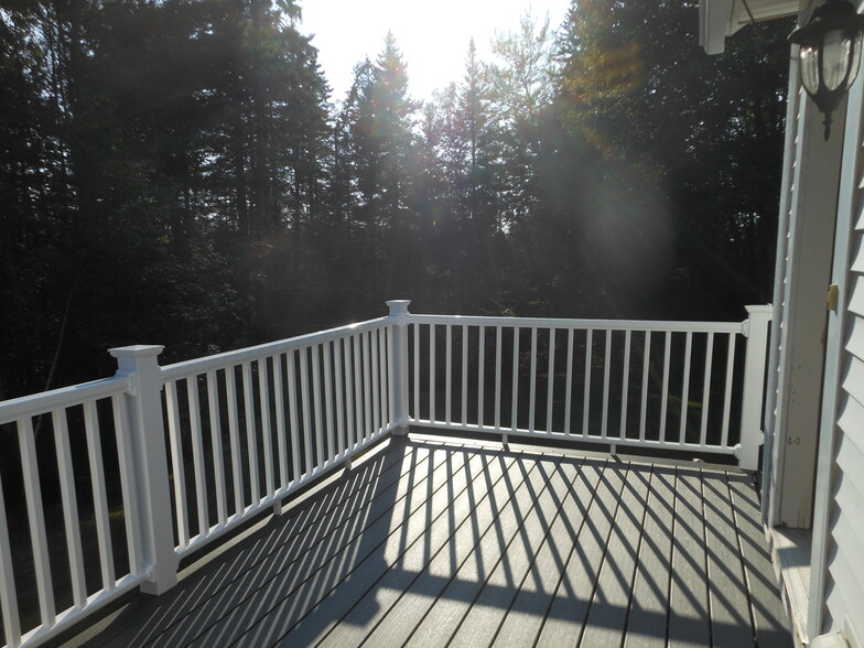 Deck off of Kitchen. This is the other side, however, it is the same kind of deck and faces the left - 75 Hutchins Mountain Rd