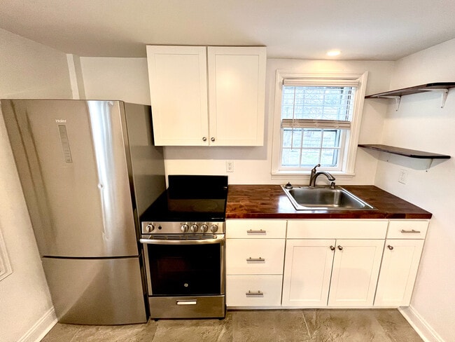 Kitchen featuring new appliances and built-in cabinets - 21 Washington St