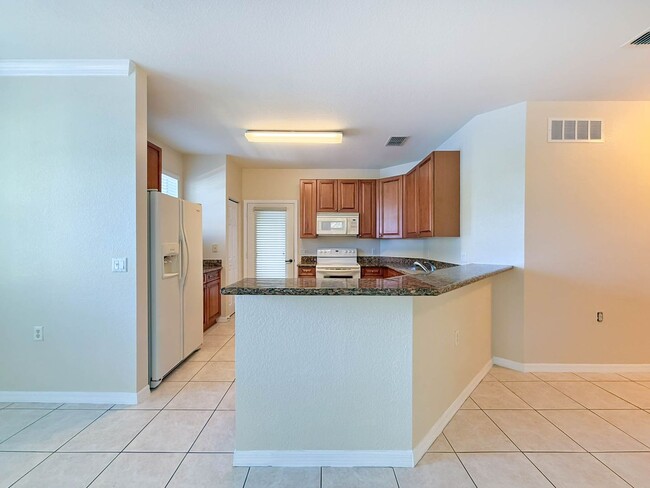 Building Photo - Beautiful 3-Bedroom Condo with 2-Car Garag...