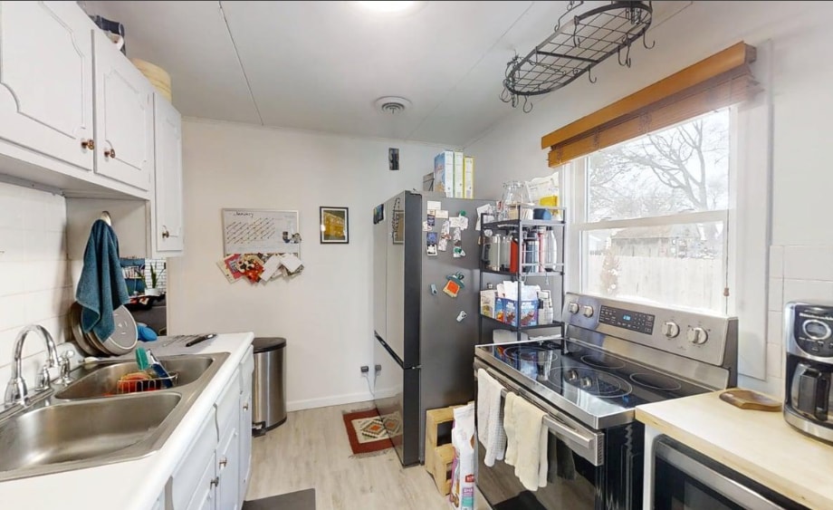 walk through kitchen to living space 1 - 1101 S Cottage Grove Ave