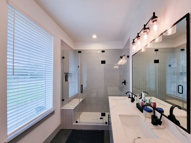 Building Photo - This 4-bedroom, 3-bathroom, two-story residence comes with a generous two-car attached garage. Re...