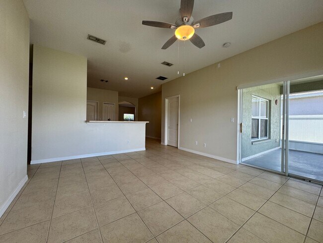 Building Photo - Beautiful 3/2 home near Lake Nona ~ Fenced In Yard ~ LVP & Tile Flooring ~ Community Pool!