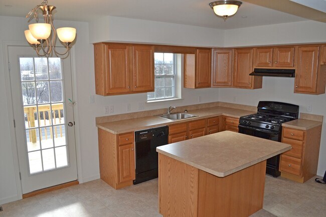 Building Photo - Fantastic Townhome - Pet Friendly (1 pet) with garage and NO MOWING!