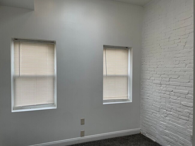 Building Photo - Charming 2-Bedroom, 1.5-Bathroom Brick Townhouse in Pigtown