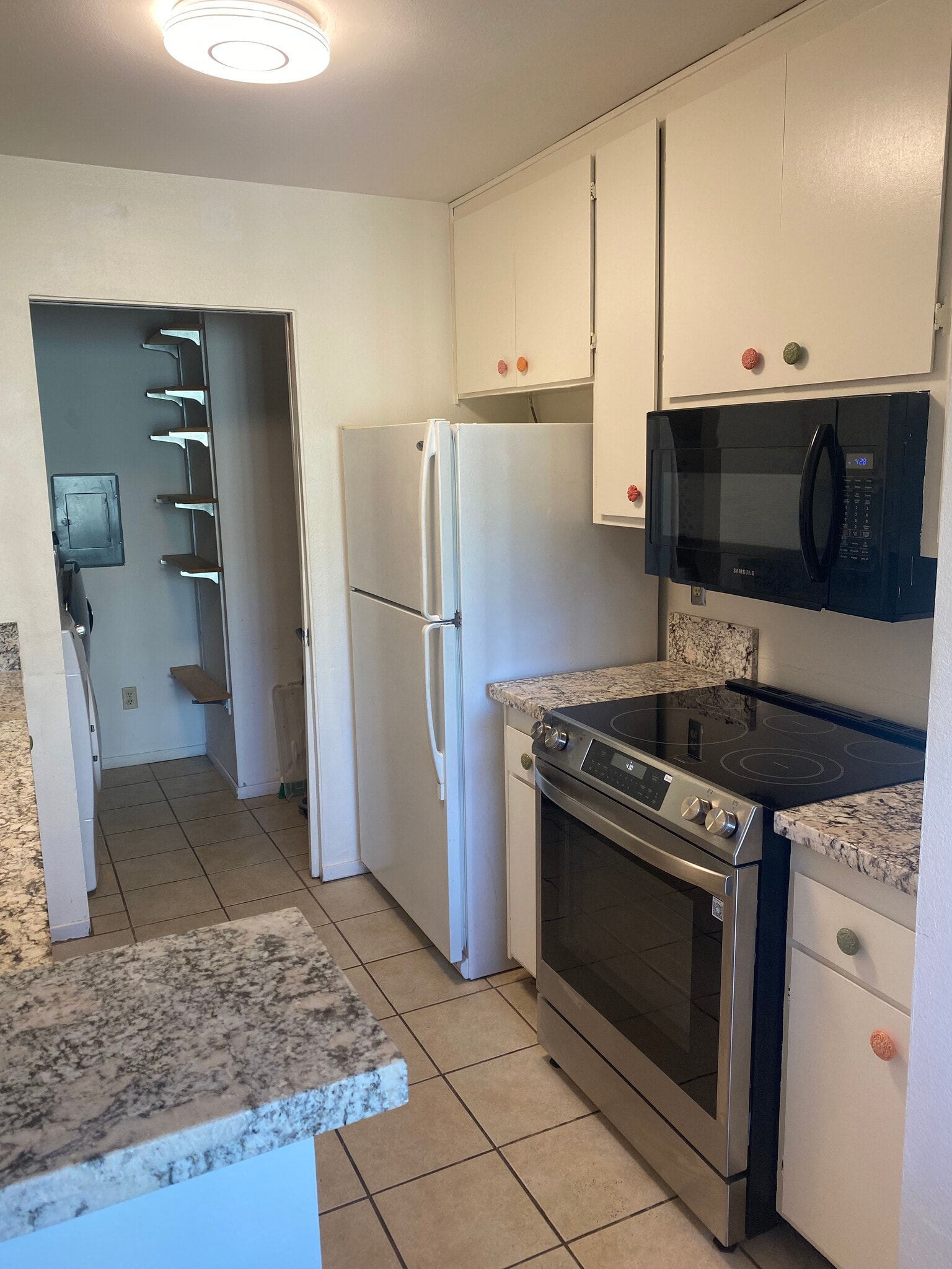 Stove / refrigerator/ laundry area - 184 W Agua Caliente Rd